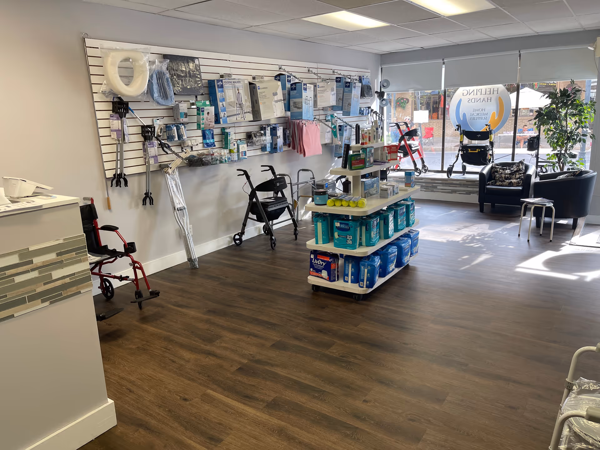Interior medical supply area in a senior home health facility with aisle display shelves