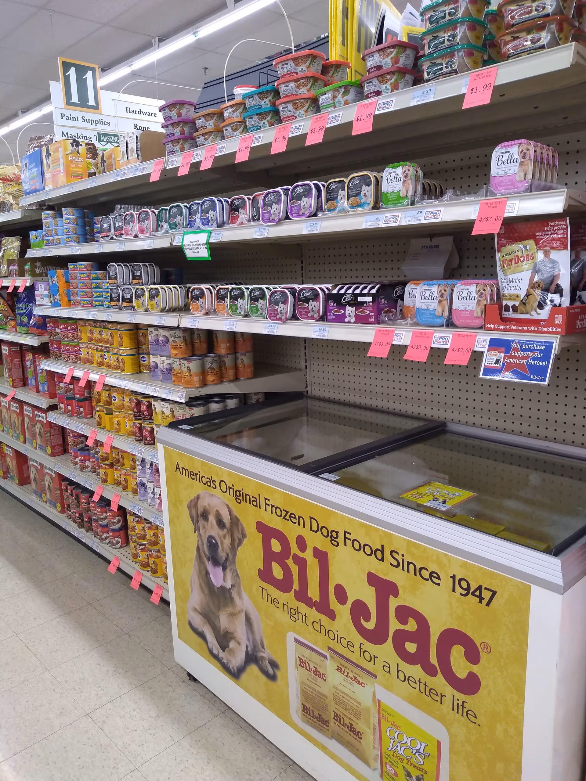 A Discount Drug Mart aisle with pet food shelves and a Bill-Jac freezer sign.