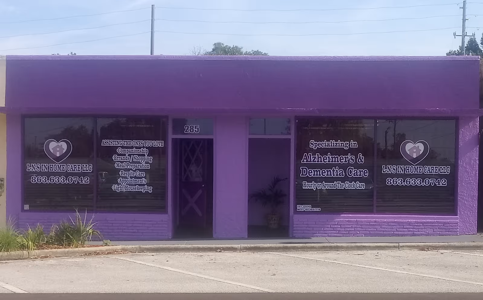 Front view of a purple building with large windows advertising LNS In Home Care LLC.