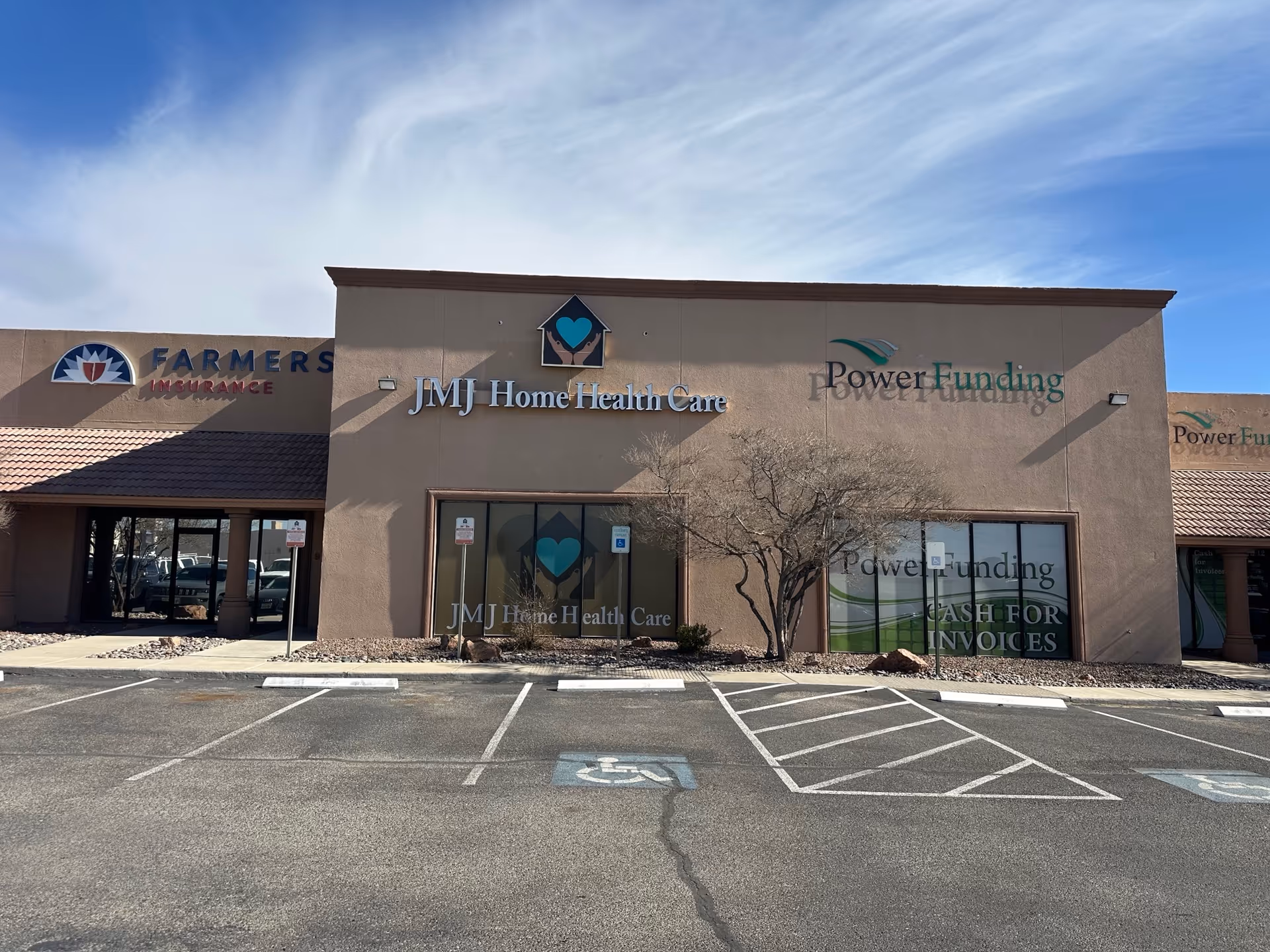 Exterior view of JMJ Home Health Care storefront with Power Funding signage and a parking lot.