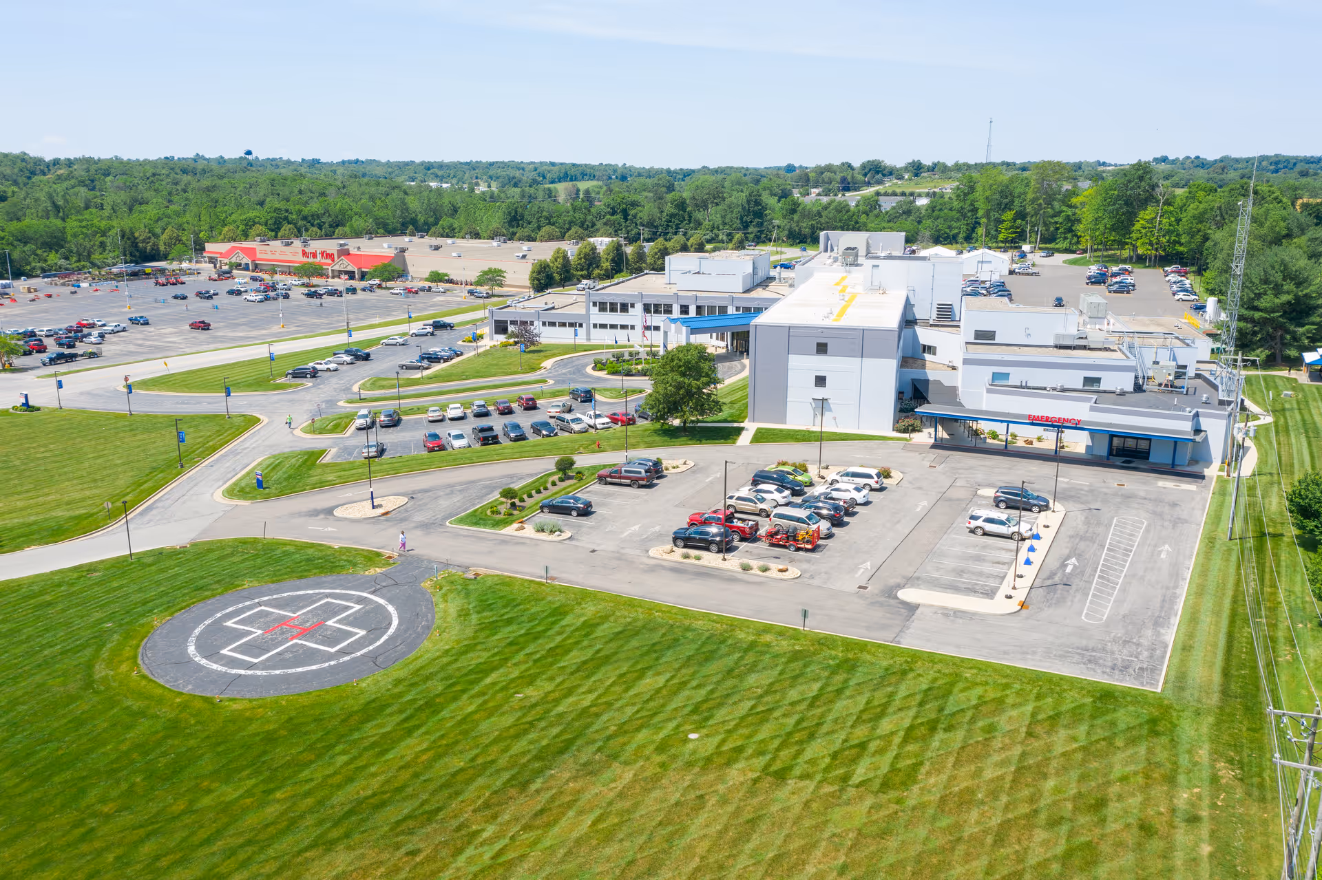 Aerial view of Highland District Hospital campus with parking and helipad.