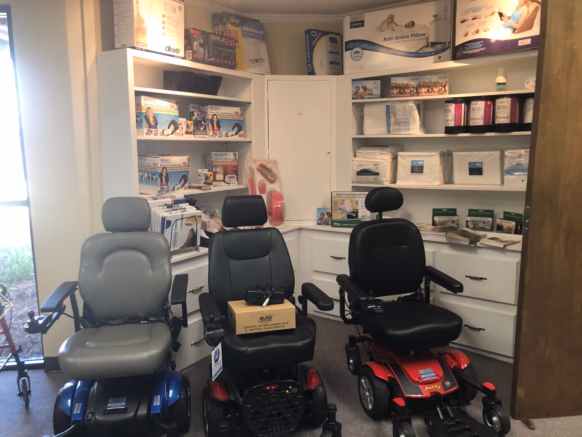 Interior showroom of Tri-State Medical Supplies with three mobility chairs and shelves.