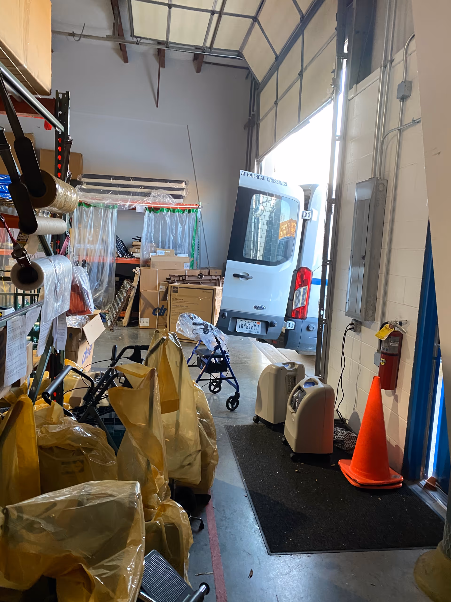 Interior storage area of a senior care facility with a LINCARE van and equipment.