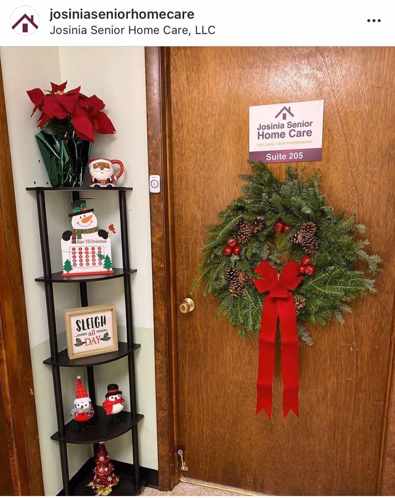 Interior doorway with holiday wreath and festive decor beside a shelving unit.