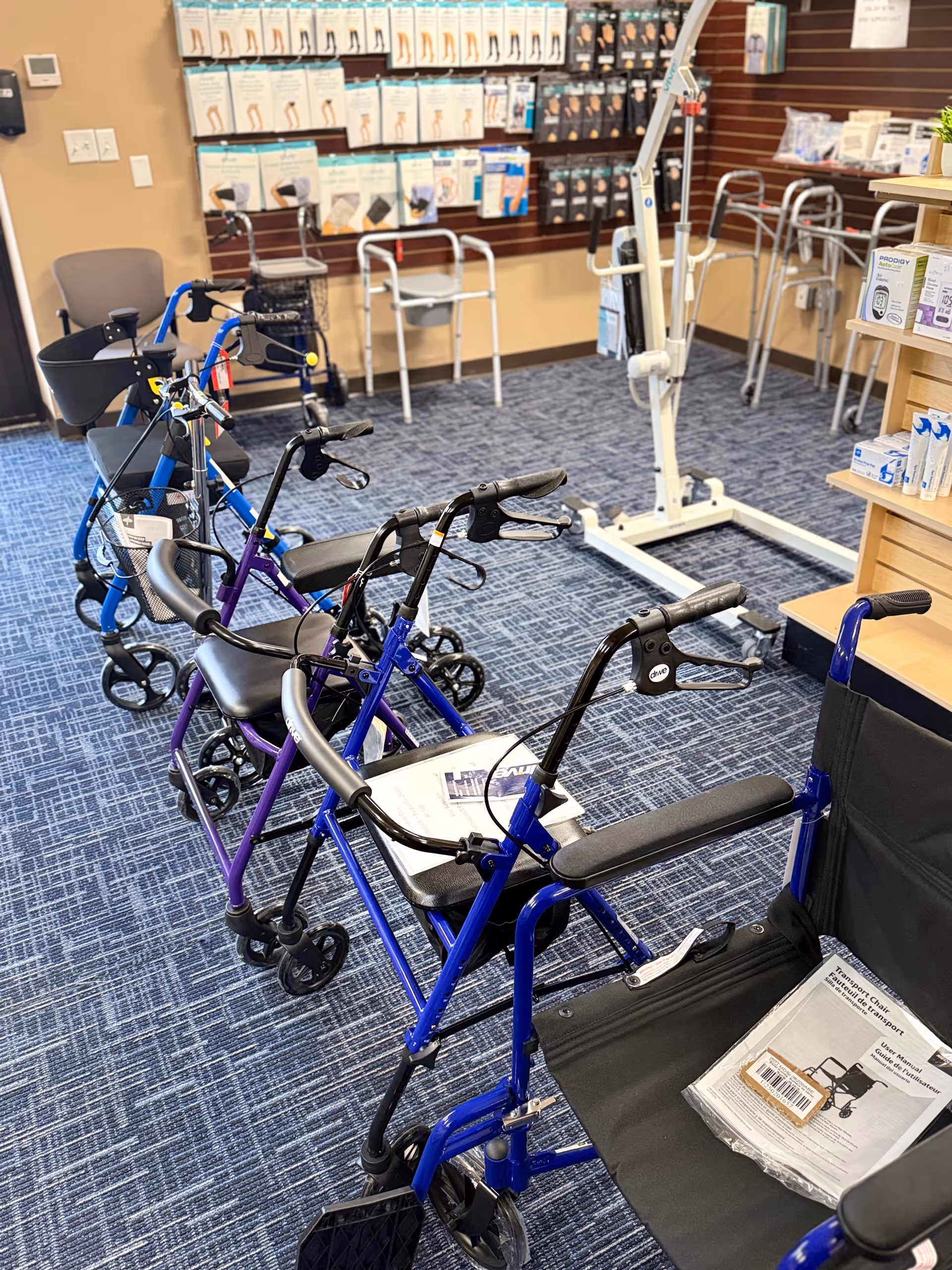 Interior showroom with walkers, rollators, and medical supplies displayed on shelves.