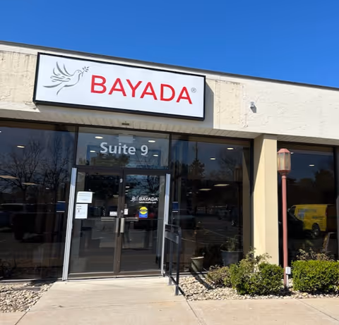 Exterior view of BAYADA Pediatrics entrance with Suite 9 sign