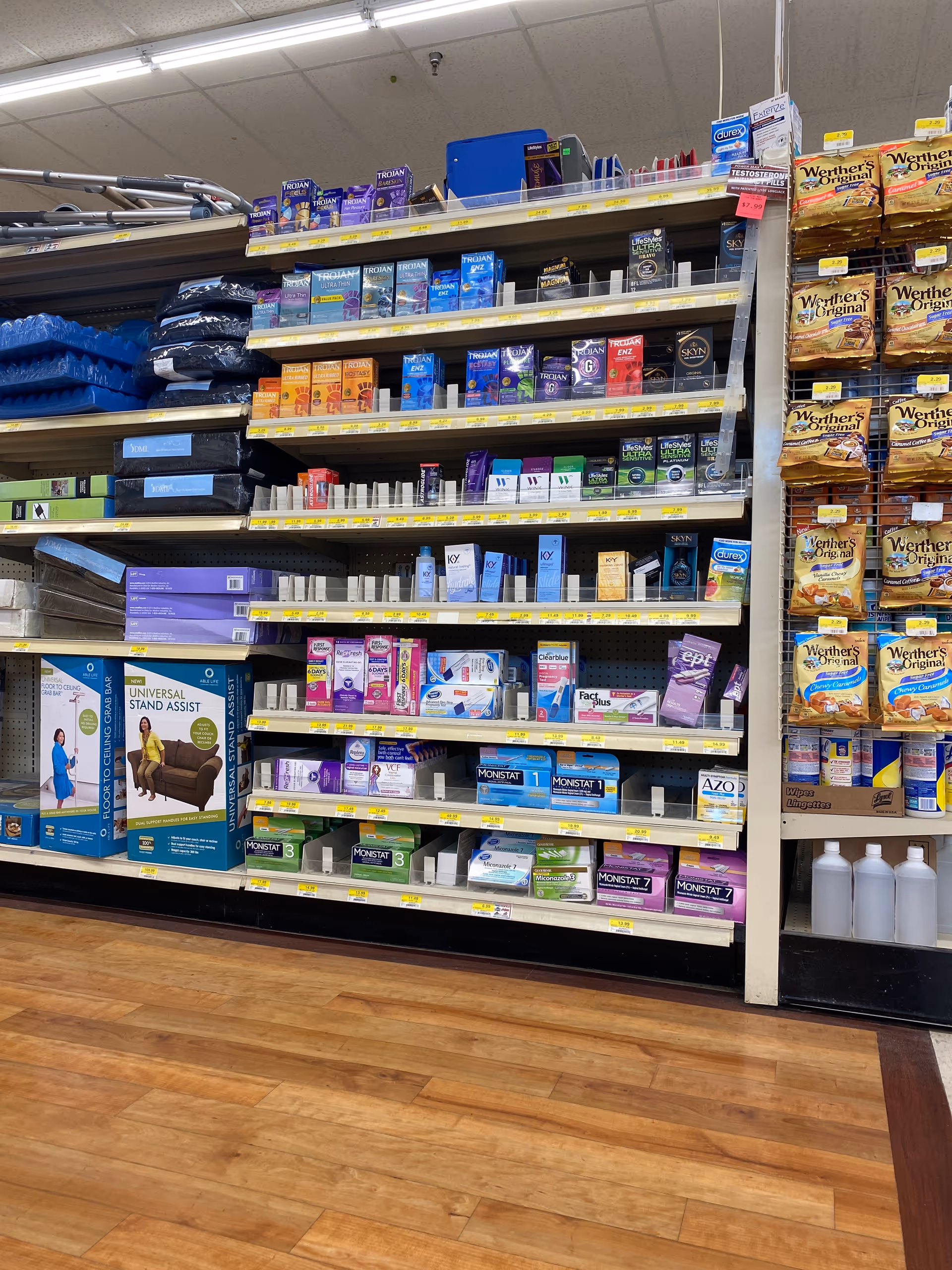 A Discount Drug Mart aisle with shelves of medications and health care products.
