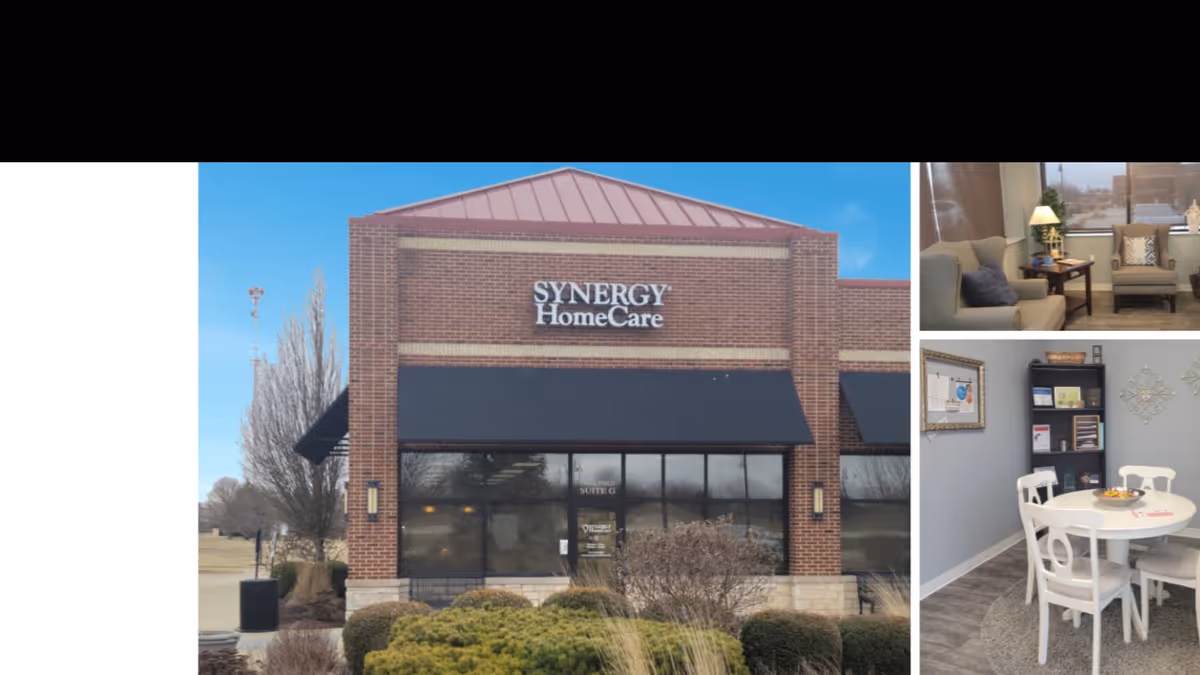 Exterior view of a brick Synergy HomeCare building, with interior living and dining spaces.