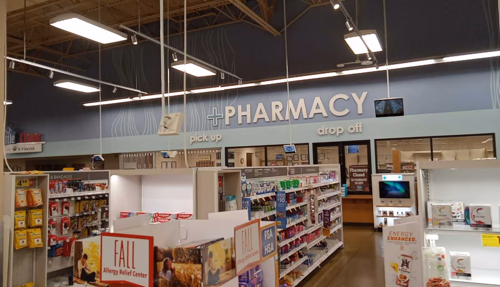 Interior view of a Kroger Pharmacy with shelves and pickup/drop-off counters.