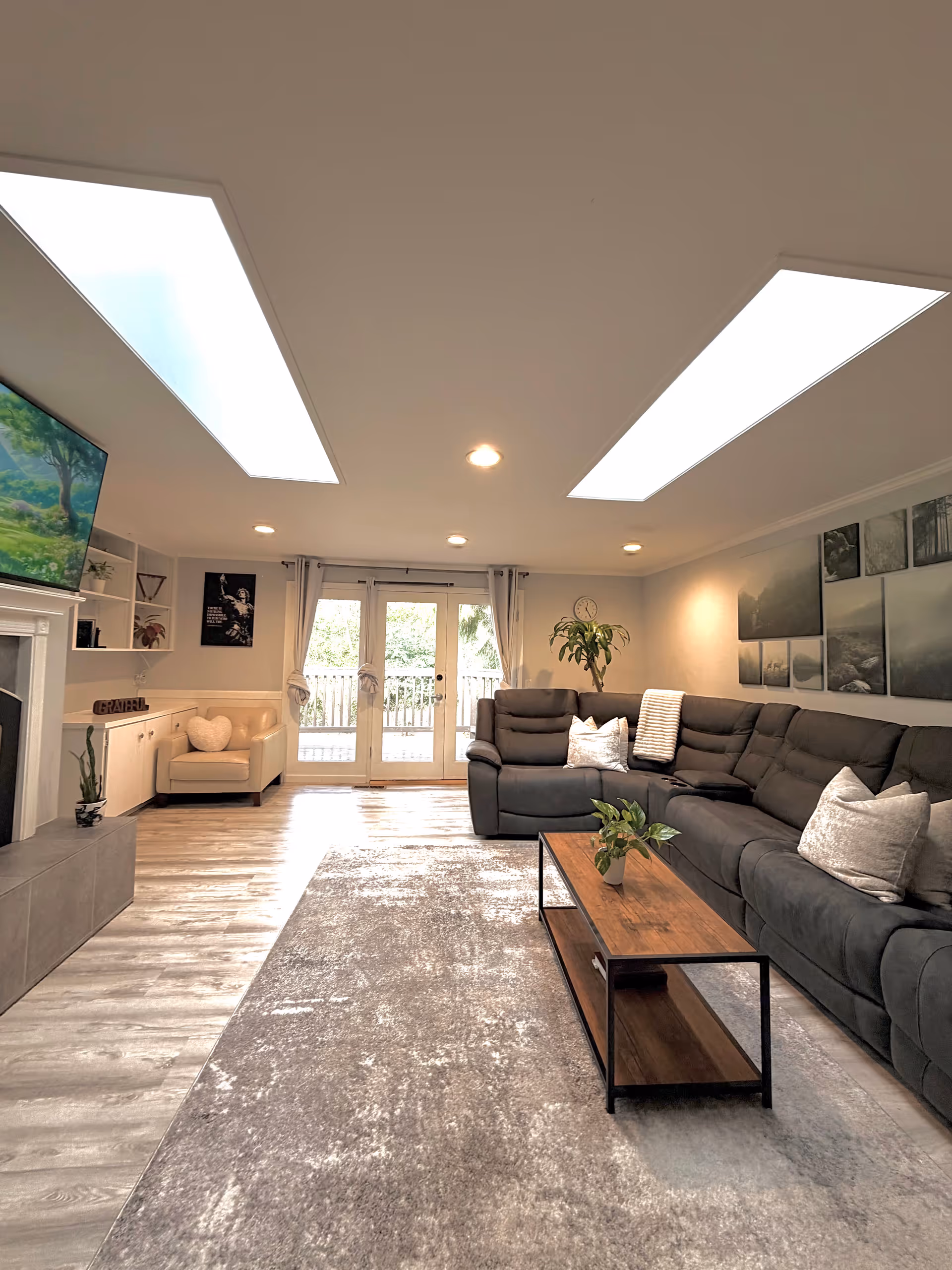 Bright, modern senior living room with a large gray sectional and coffee table.