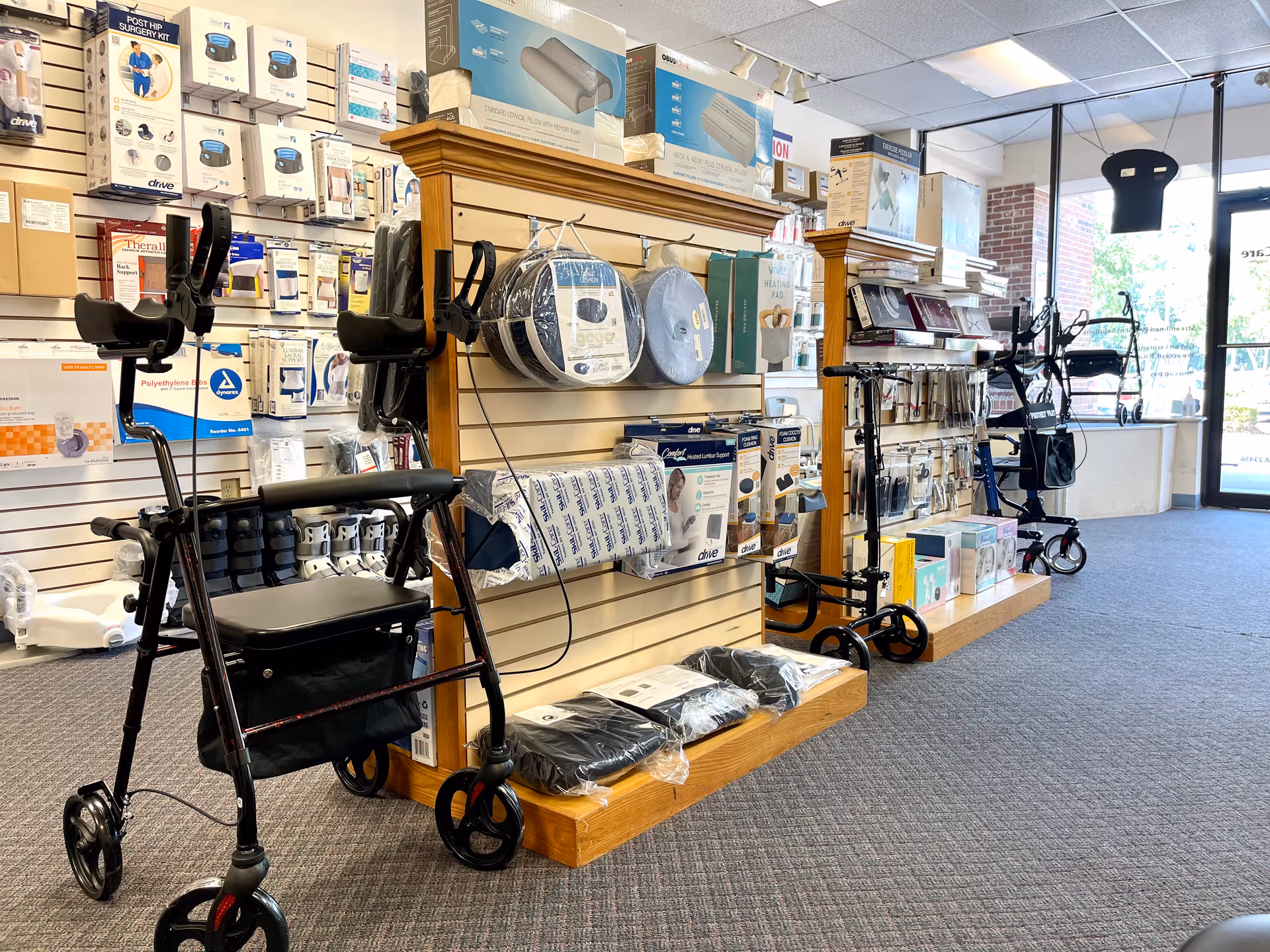Interior of a medical supply store with walkers, boxes, and display shelves.
