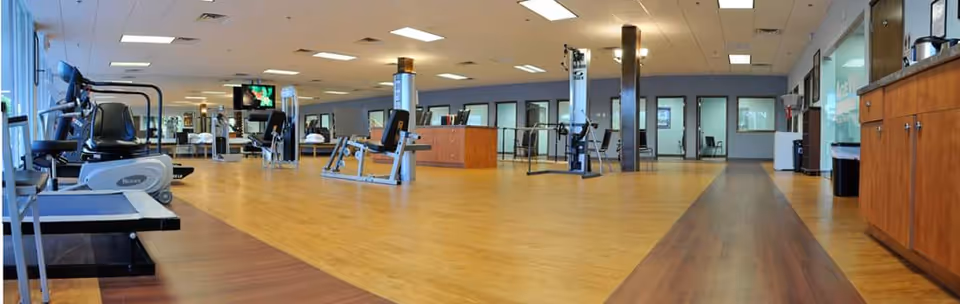 A spacious senior fitness gym inside AgeWell Physical Therapy and Wellness, P.C. with treadmills.