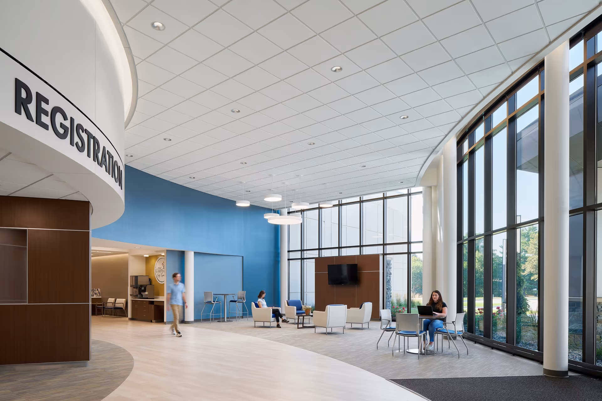 Providence Medical Center lobby with curved registration desk, blue wall, seating, and large windows.