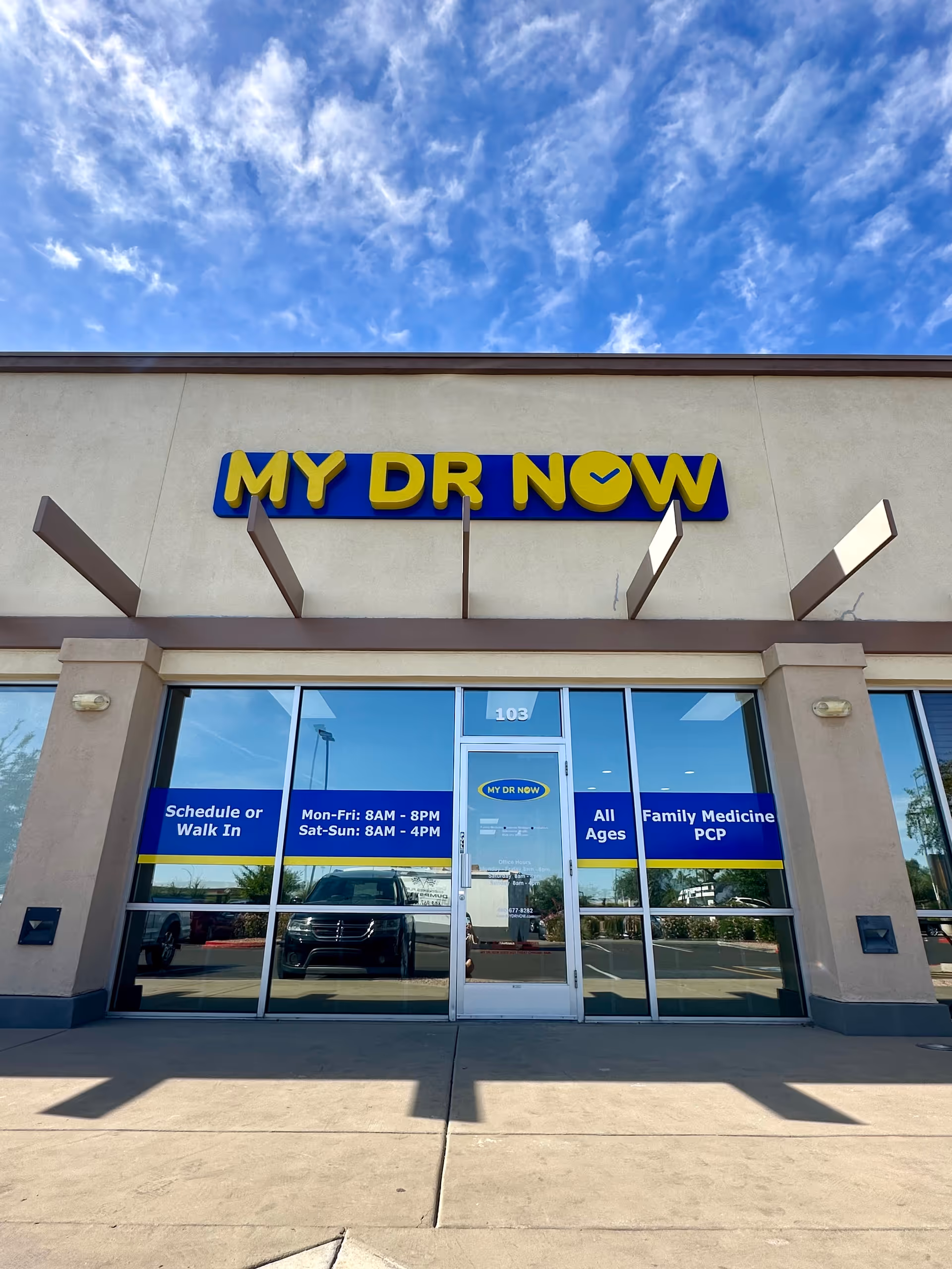 Front exterior of MY DR NOW clinic with glass doors and blue signage.