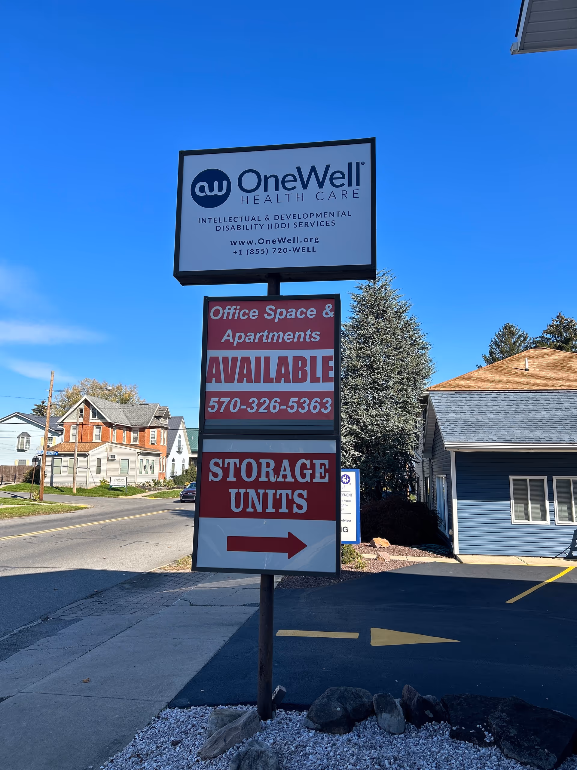 Outdoor sign for OneWell Health Care advertising Office Space, Apartments, and Storage Units.