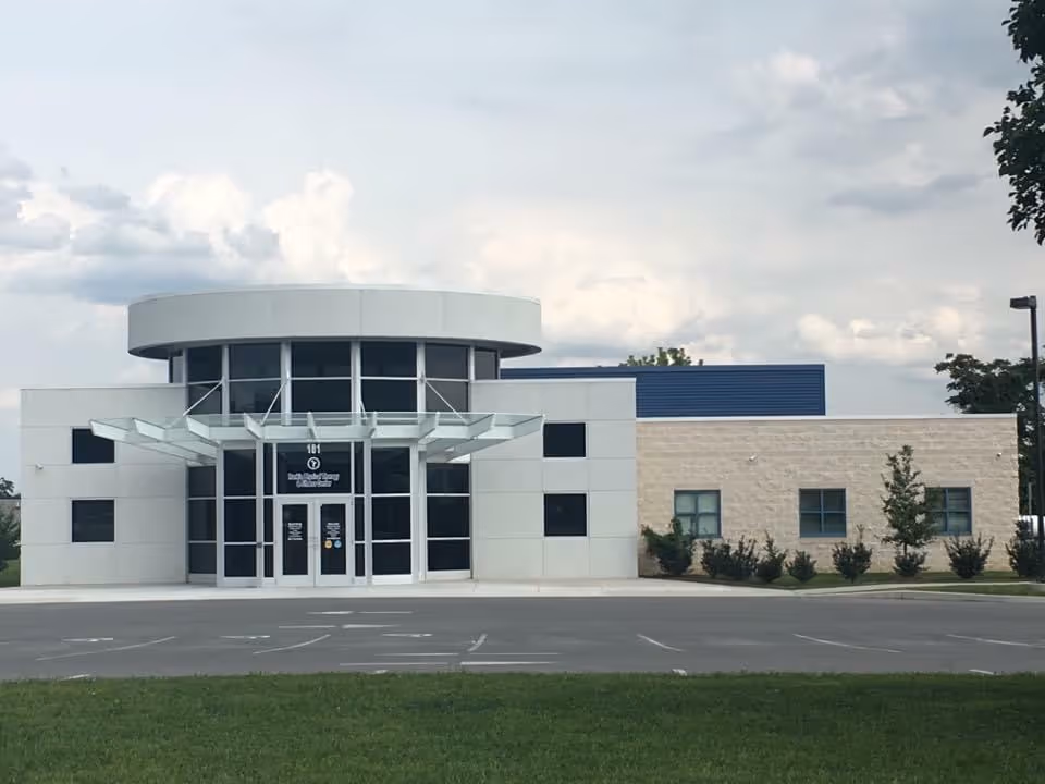 Front view of Rankin Home Health building with glass doors and curved canopy.