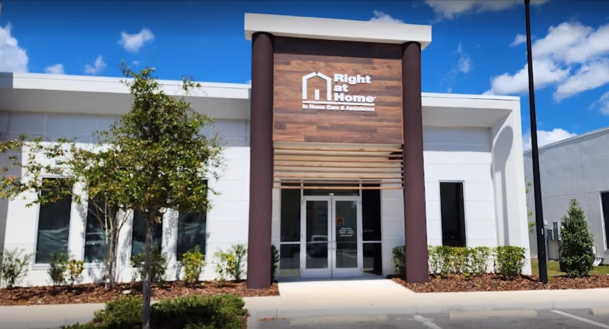 The front exterior of Right at Home senior care facility features signage and entrance doors.