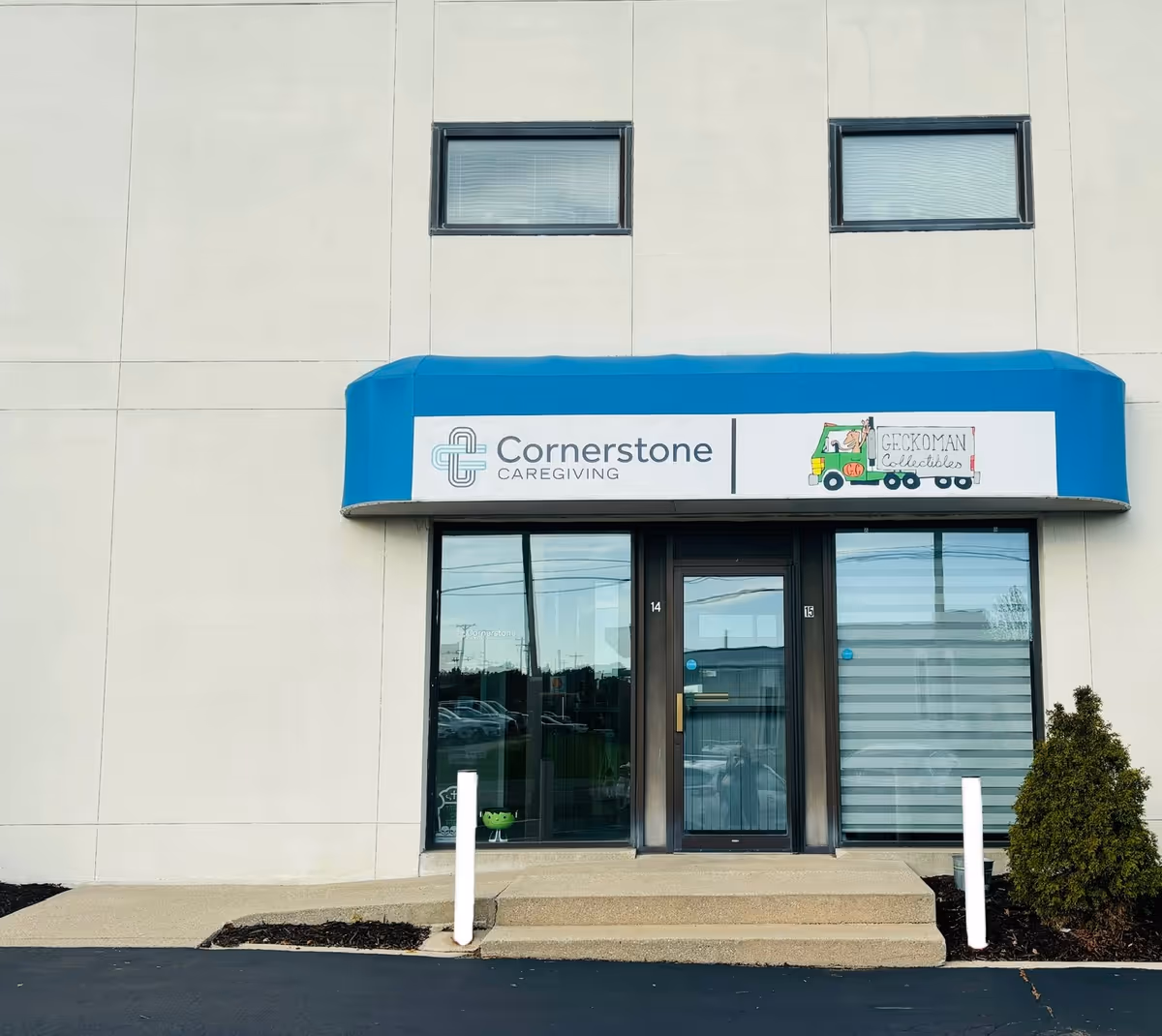 Front entrance of Cornerstone Caregiving building with blue canopy sign.