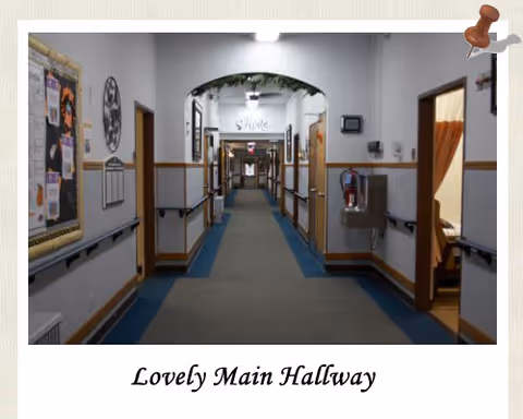Long interior hallway in Nu-Roc Community Healthcare with doors to rooms and arched ceiling.