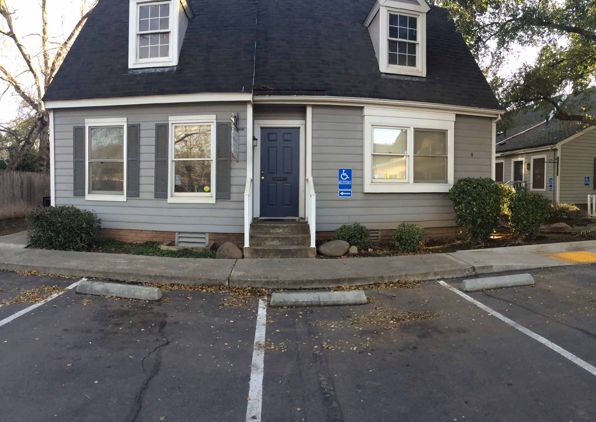 Front view of a BrightStar Care senior facility with accessible entrance and parking.