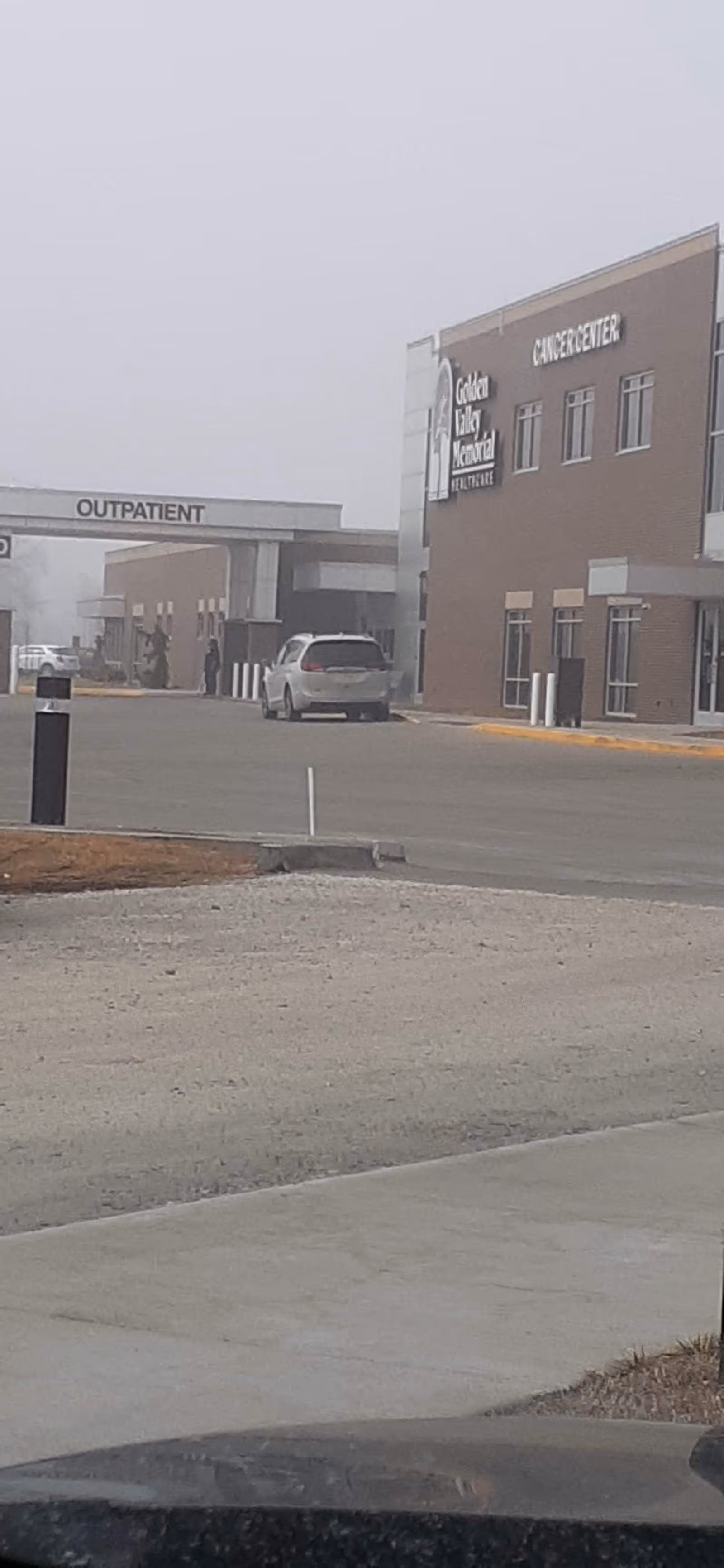 Exterior view of Golden Valley Memorial Healthcare with outpatient entrance and parked vehicle