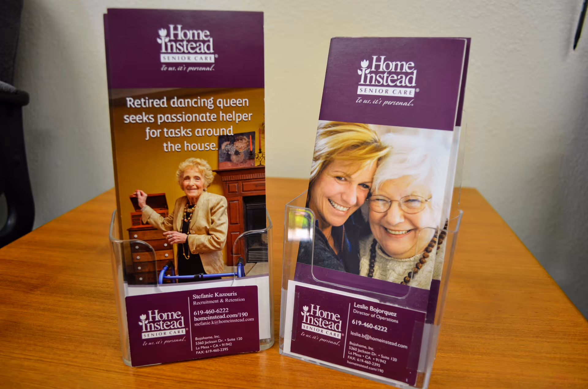 Two Home Instead brochures on a wooden table in an interior setting.