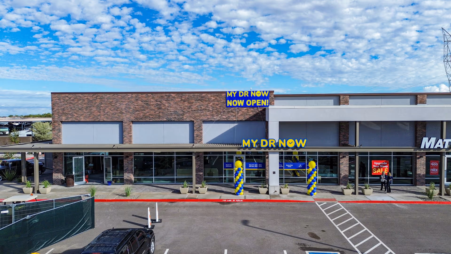 Exterior view of MY DR NOW storefront with blue and yellow balloons