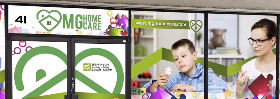 Storefront of MG Home Care with colorful logo and a woman and child pictured in windows.