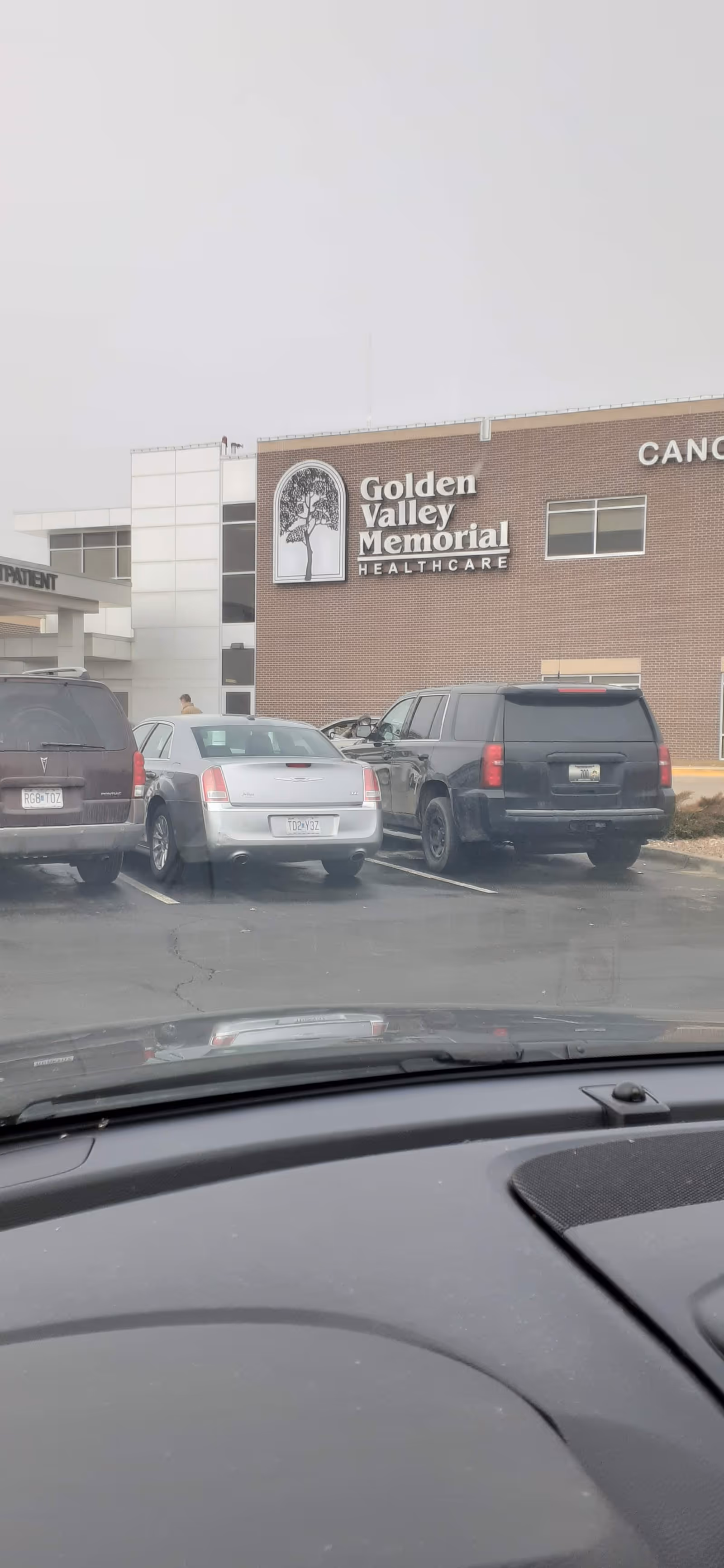 Parking lot view of Golden Valley Memorial Healthcare building exterior with parked cars