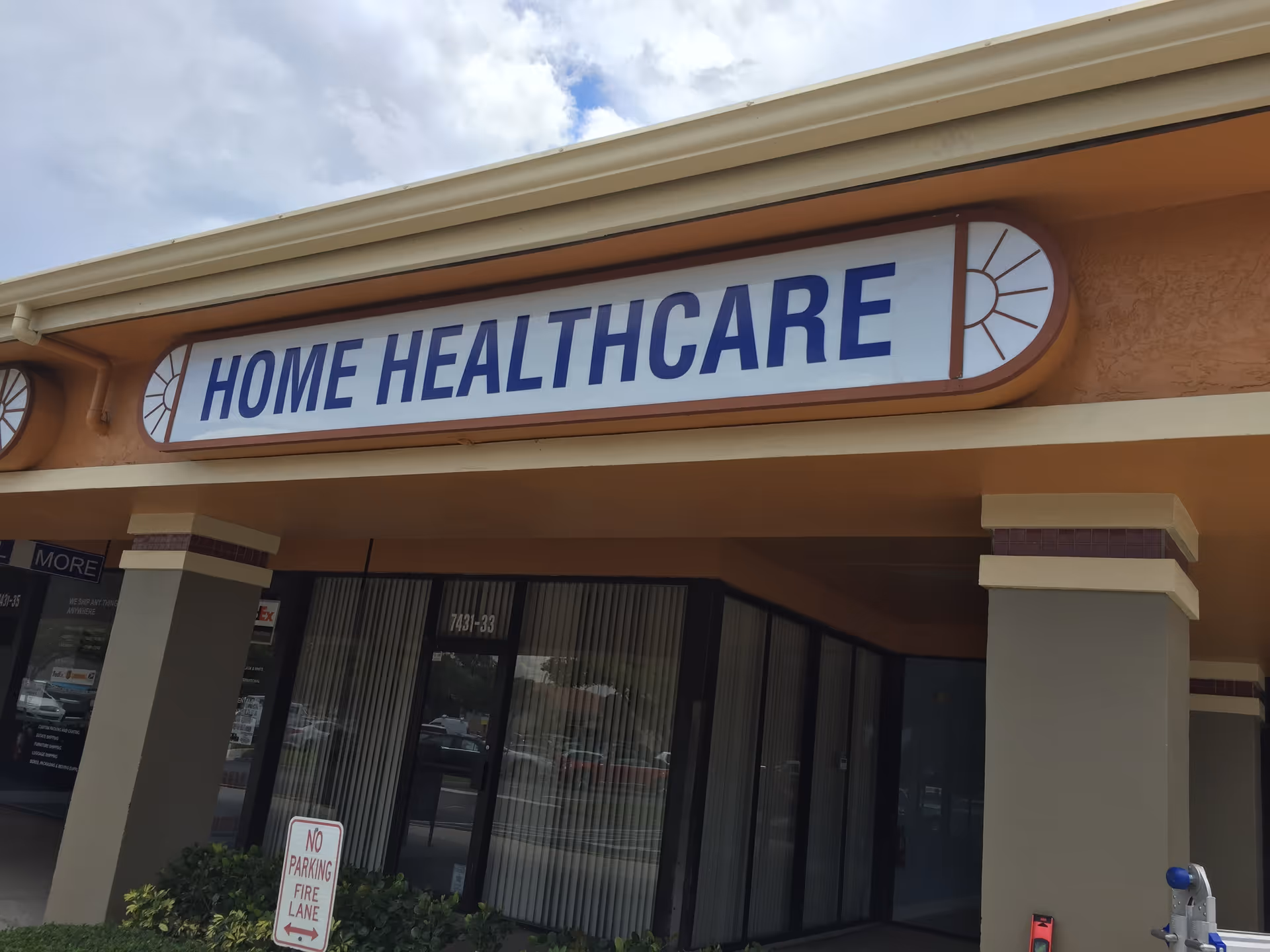 Orange storefront with large HOME HEALTHCARE sign above glass doors