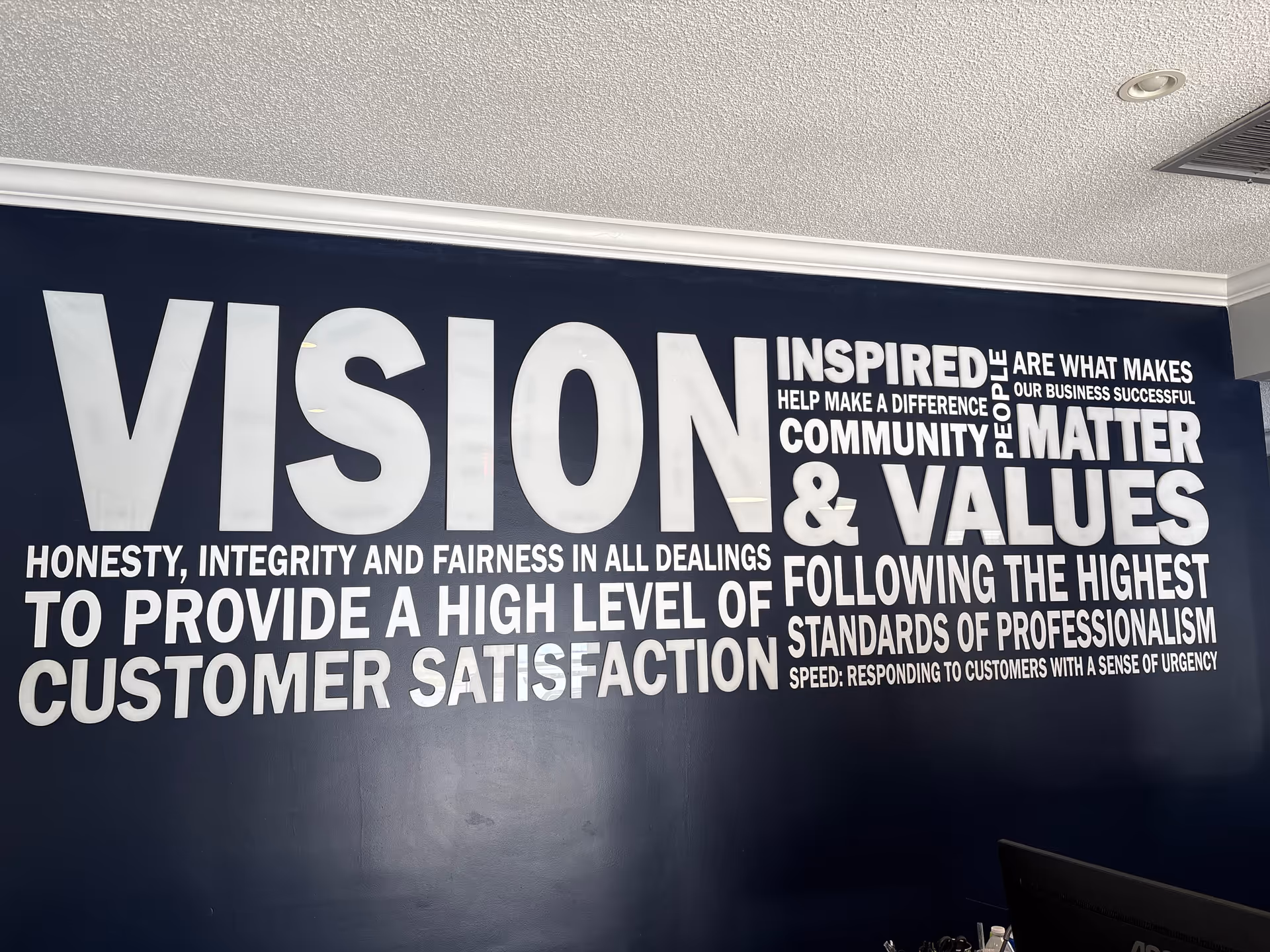 Blue interior wall features a large white 'VISION' text mural.