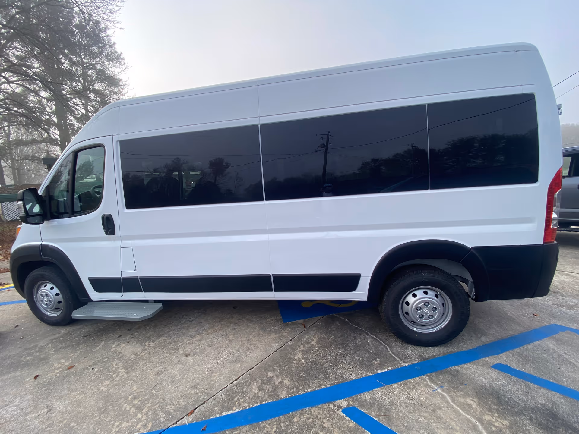 White MobilityWorks van with dark windows parked in a lot.