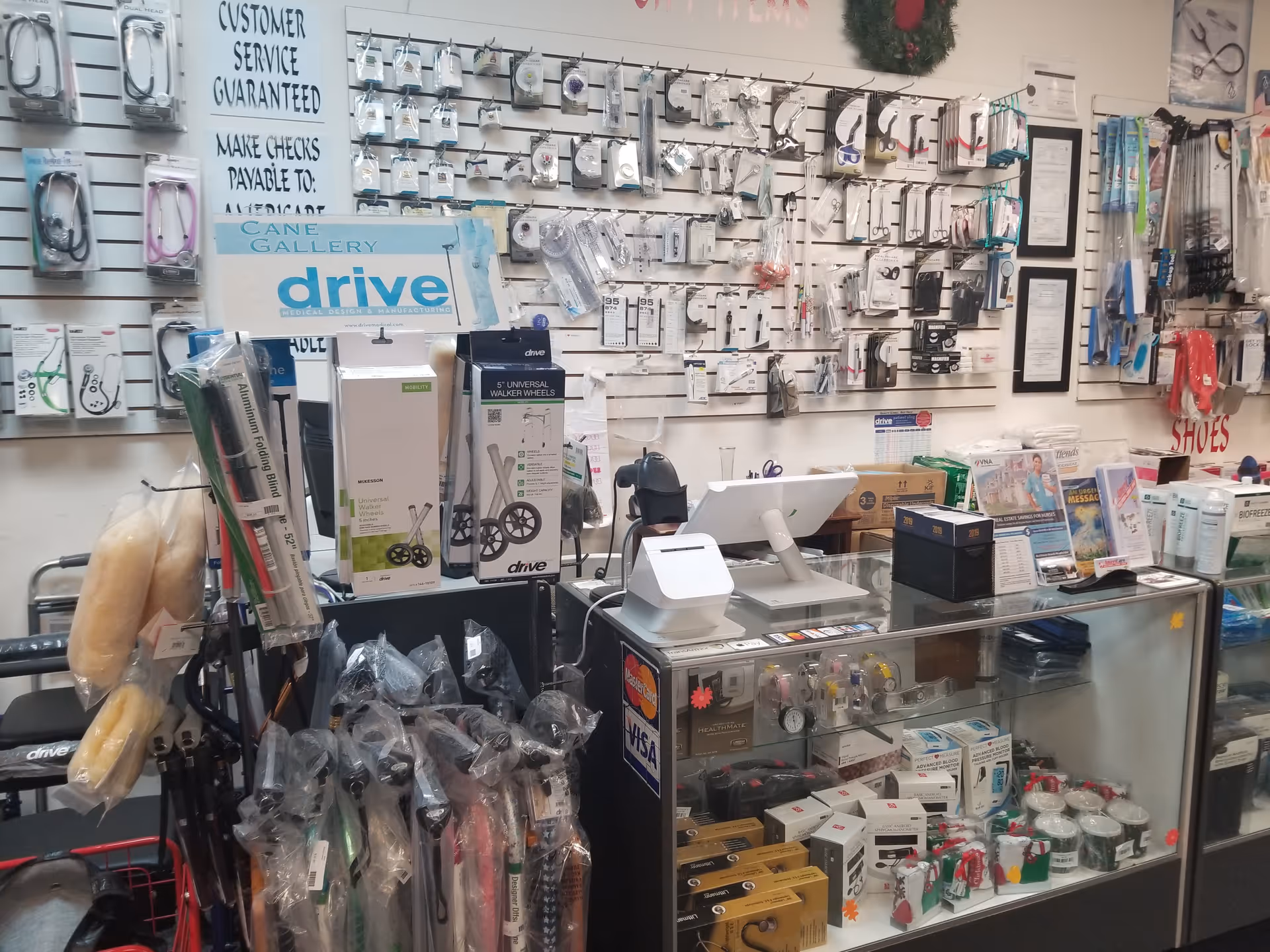 Interior of a medical supply shop with wall-mounted accessories and a glass display counter.