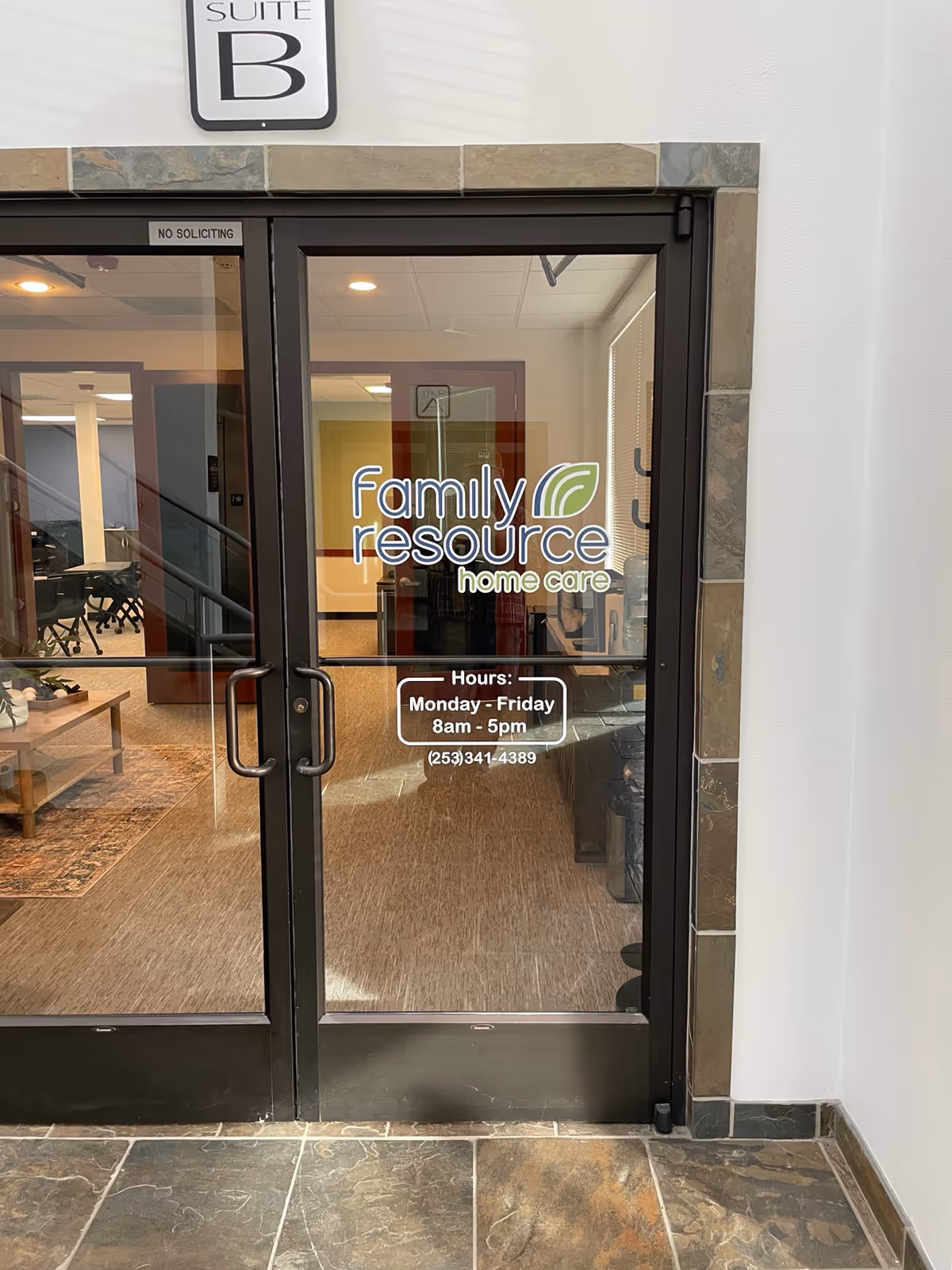 Glass front doors to Family Resource Home Care lobby, interior seating and reception area visible.