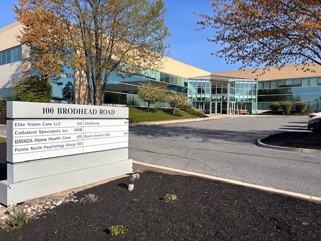Exterior view of BAYADA Assistive Care State Programs building with front sign.