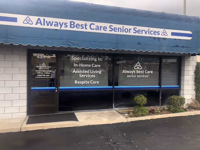 Front exterior of Always Best Care Senior Services storefront with blue awning and windows.