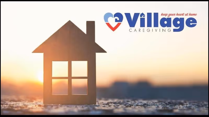 Silhouette of a small wooden house on a textured surface at sunset with Village Caregiving logo.