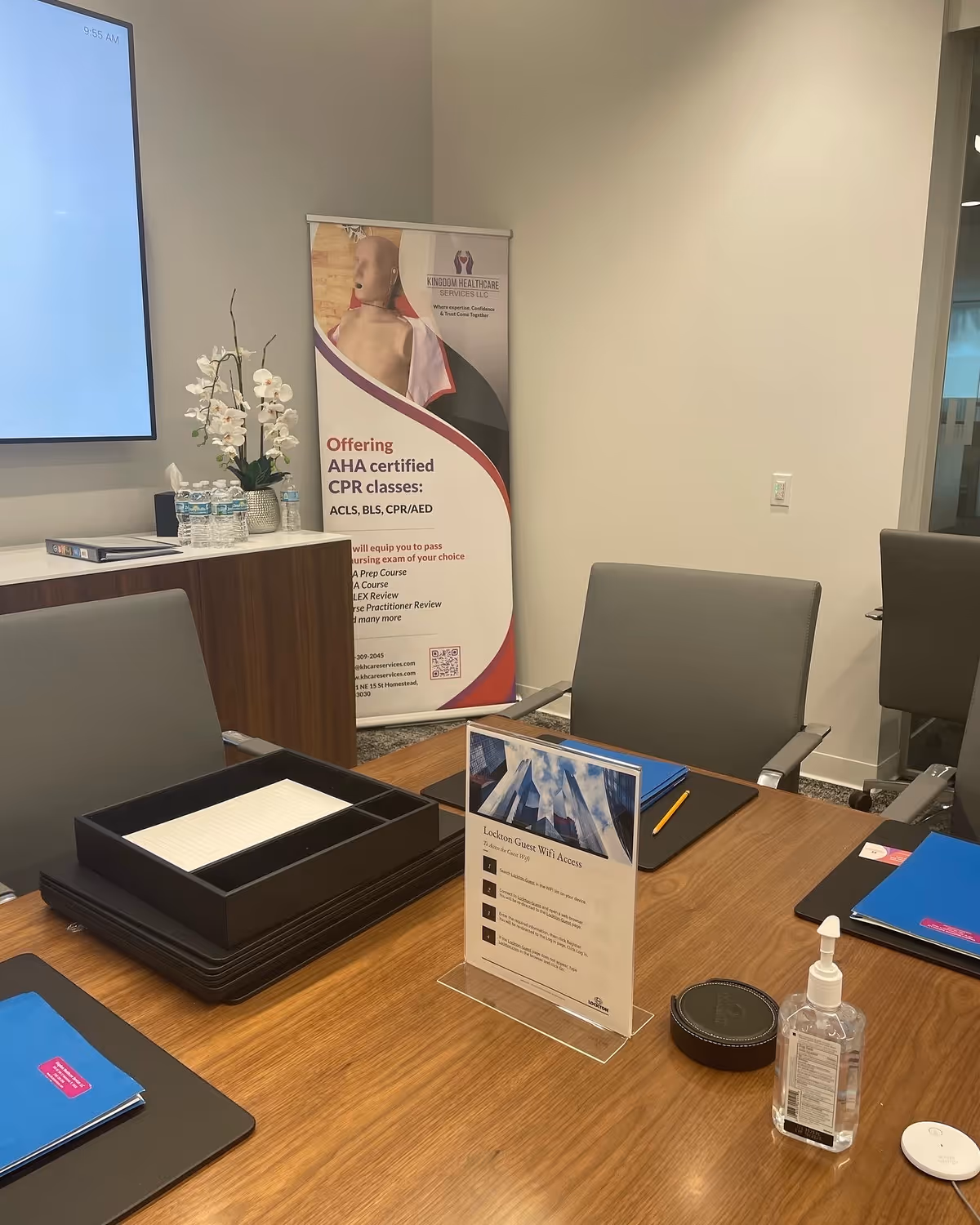 Meeting room setup with banner promoting CPR classes at Kingdom Healthcare Services.