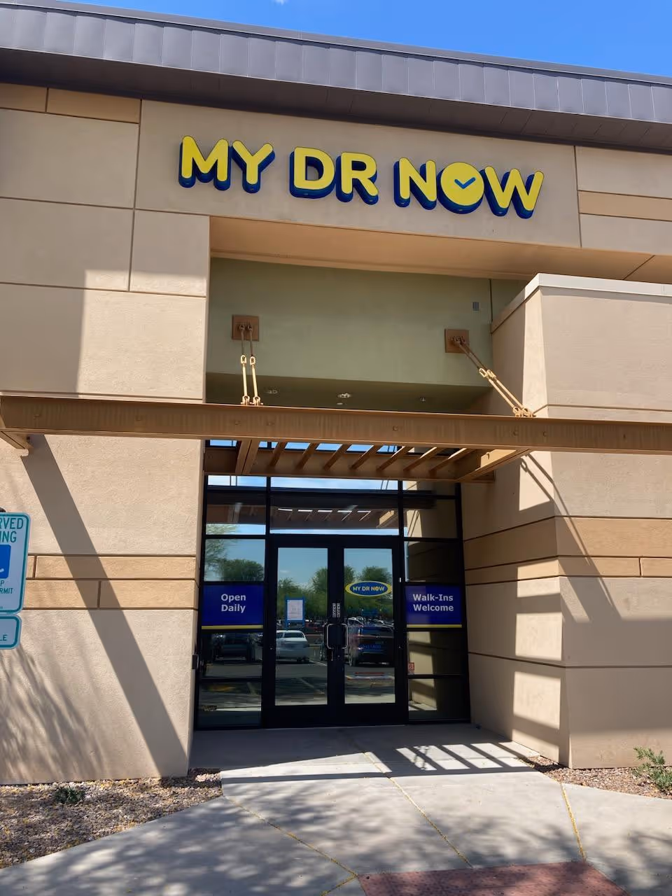 Exterior view of MY DR NOW building entrance with glass doors.