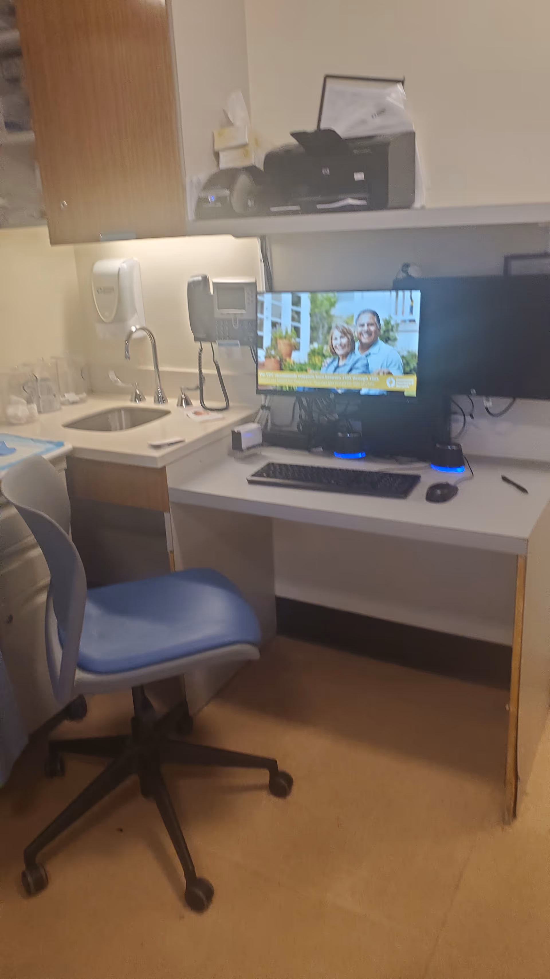 Interior nurse station at Community Healthcare Network Crown Heights with computer and sink.