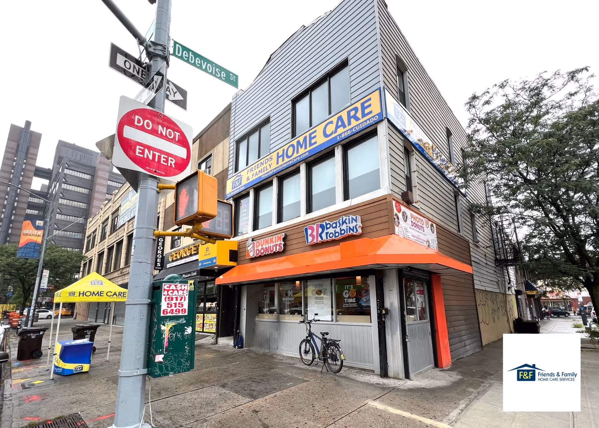 Urban corner storefront with home care signs; adjacent Dunkin' Donuts and Baskin-Robbins.