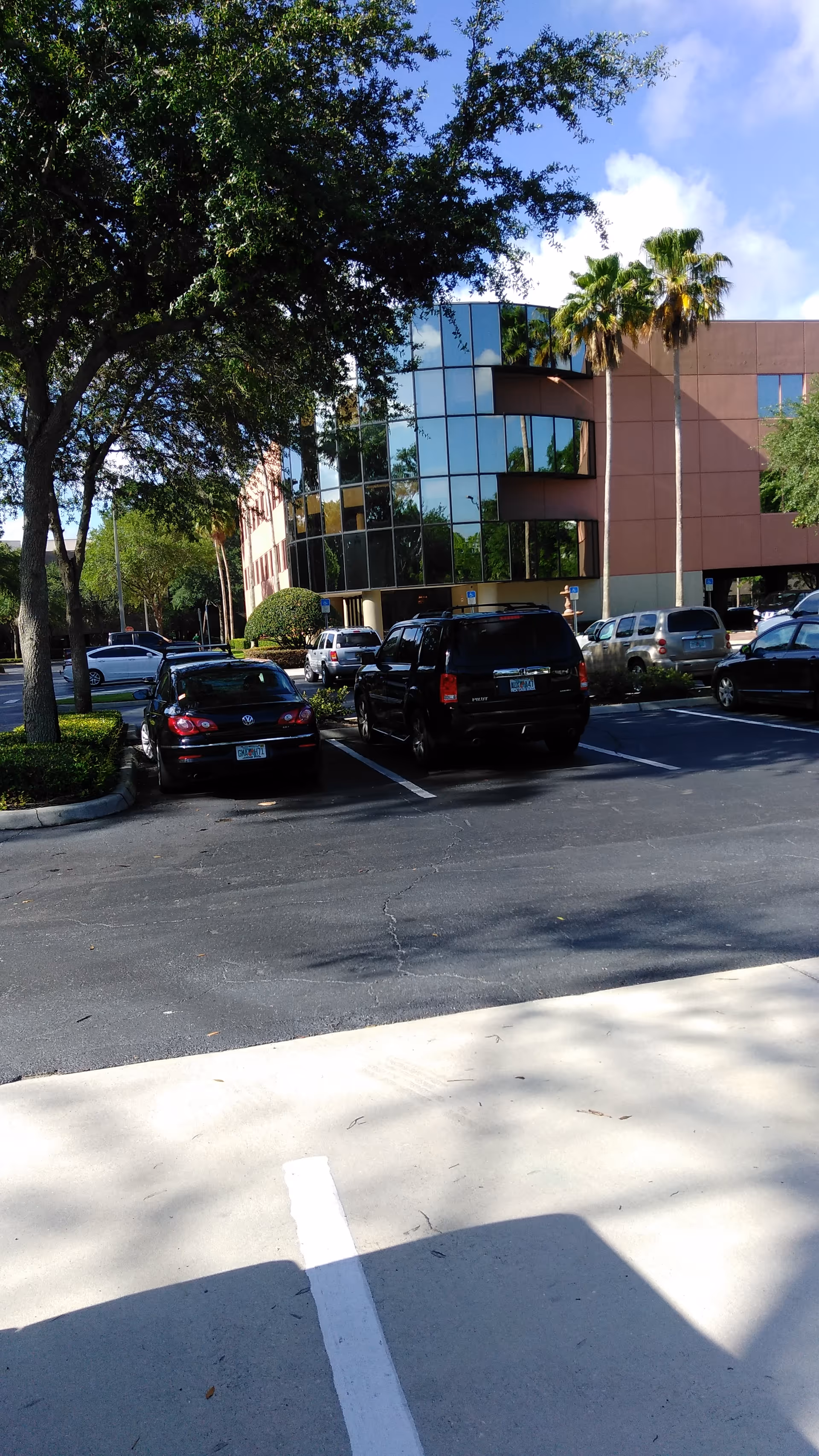 Park Place Surgery Center exterior with glass facade and surrounding parking lot.