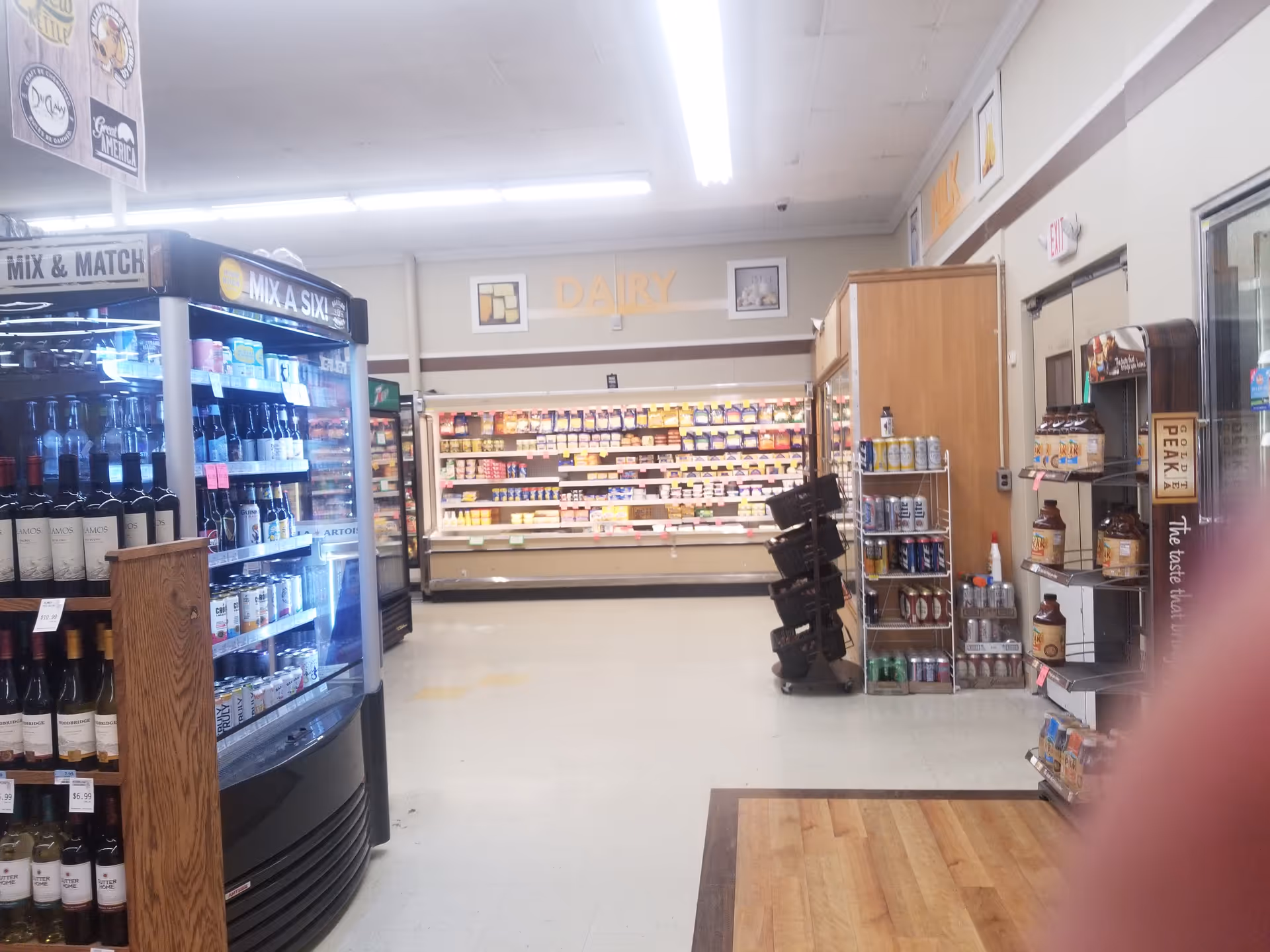 Interior of Discount Drug Mart store with a dairy section and refrigerated displays.