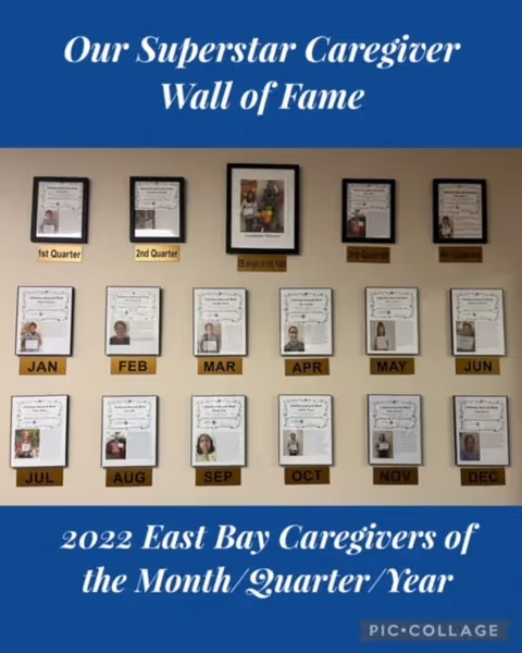 Interior wall display titled Our Superstar Caregiver Wall of Fame with monthly certificates.