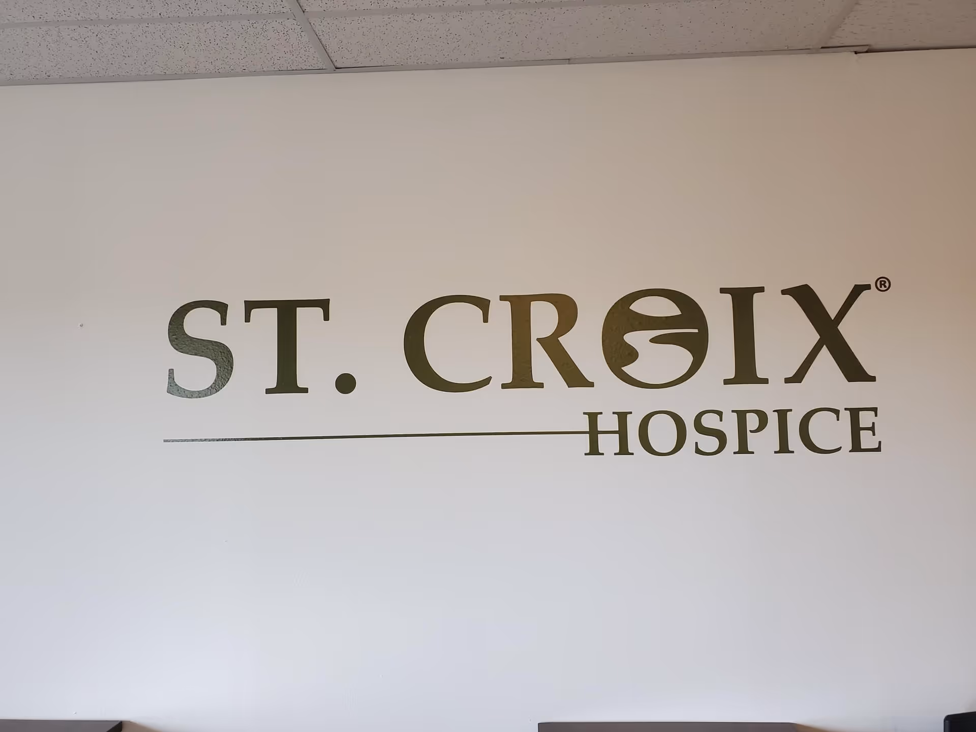 Interior wall featuring the St. Croix Hospice logo and branding.