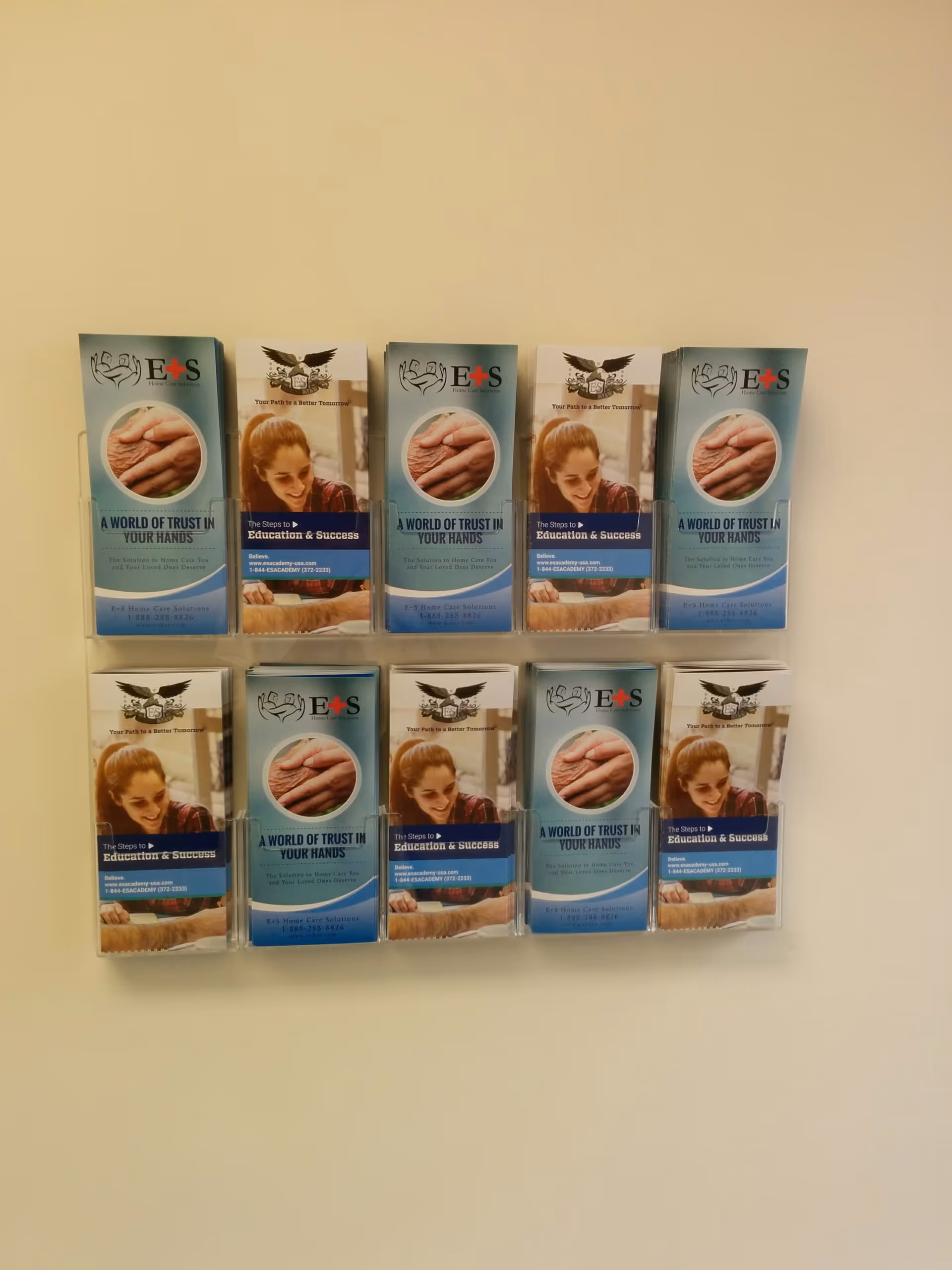 Wall-mounted brochure racks display multiple E&S Home Care Solutions pamphlets.