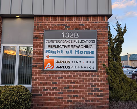 Exterior brick building with a large 'Right at Home' sign and related business logos.