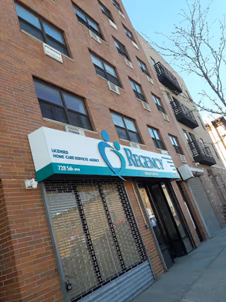 Exterior view of a brick building with Regency Health Care storefront and sign