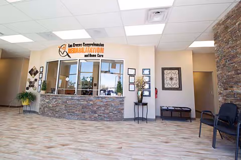 Interior lobby at Las Cruces Comprehensive Rehabilitation with reception desk and seating.