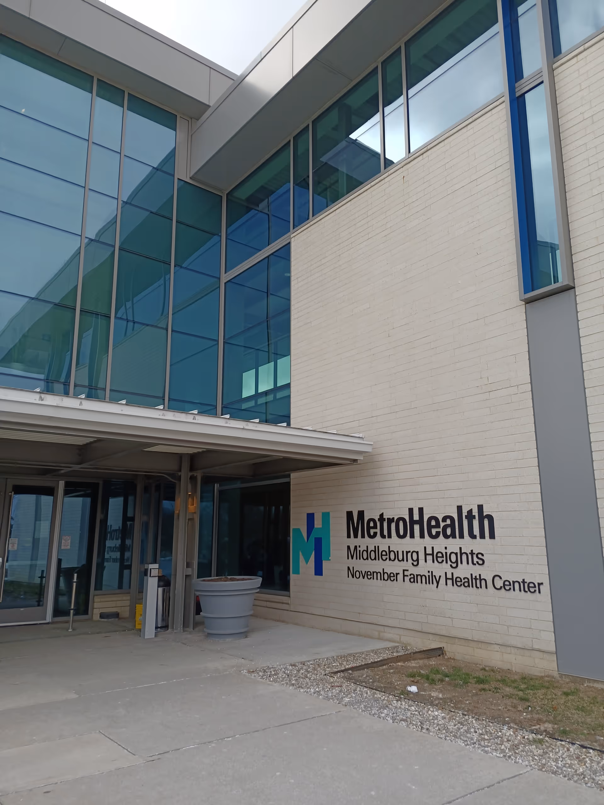 Exterior view of the MetroHealth Middleburg Heights November Family Health Center entrance with glass facade.